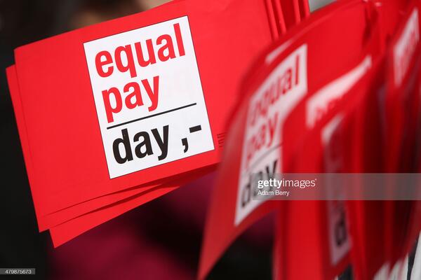 BERLIN, GERMANY - MARCH 21:  Flags reading 'Equal Pay Day' are seen during the 'Equal Pay Day' demonstration on March 21, 2014 in Berlin, Germany. The annual event recognizes the wage gap between the sexes in the country, where women's